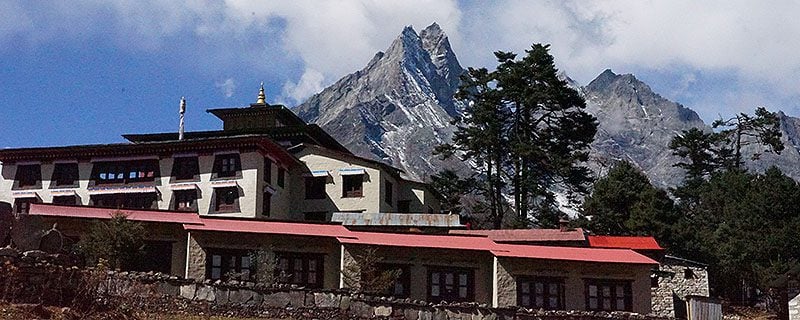 Hotel with snow-capped mountains behind
